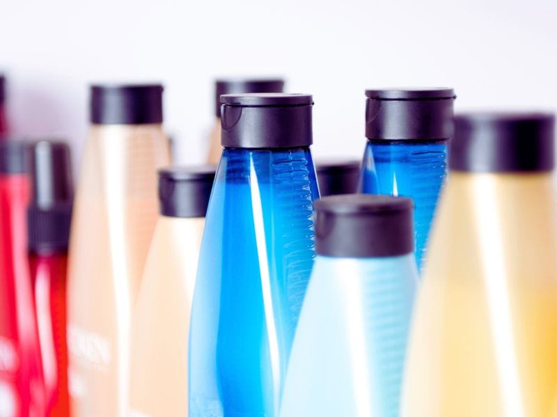 Assorted retail haircare bottles that support scalp health and help prevent hair thinning or balding.