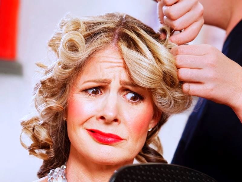 Unhappy salon client with concerned expression, showing how poor communication can push clients away.