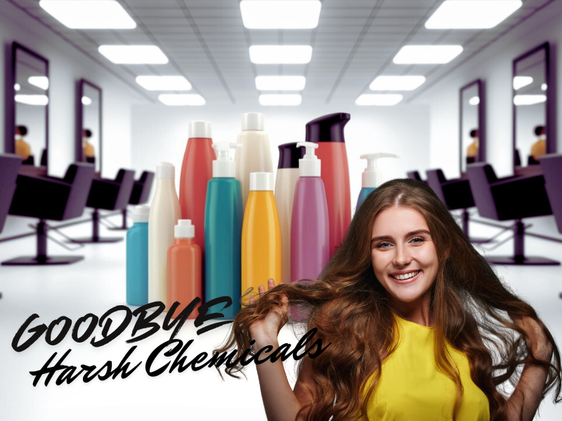 Smiling woman in salon holding her healthy hair with colorful shampoo bottles in background and the phrase ‘Goodbye Harsh Chemical’ promoting clean haircare.