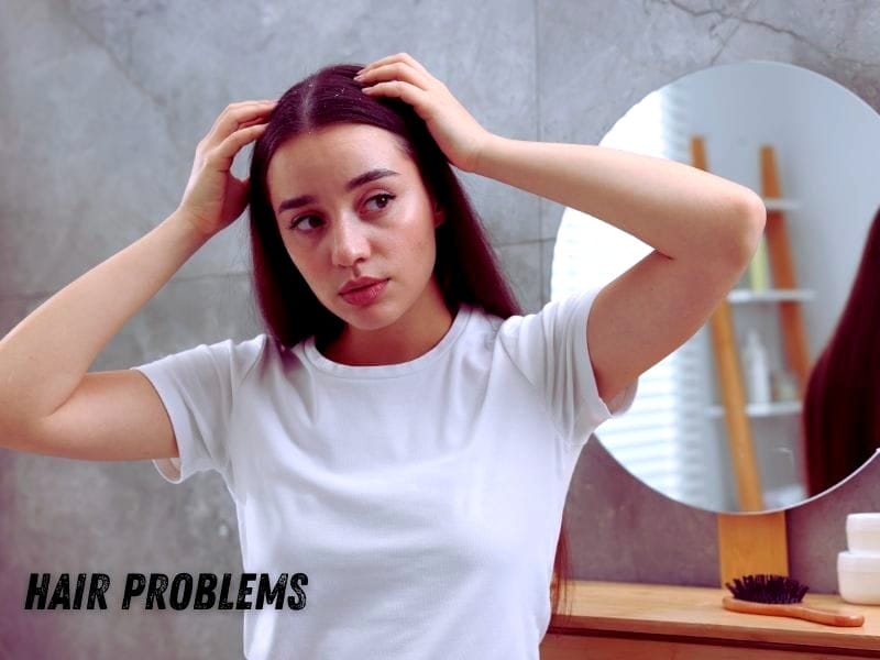 Woman checking her scalp in the mirror, concerned about possible hair thinning or scalp issues.