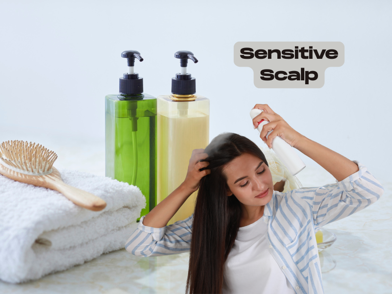 Woman spraying hair product onto scalp next to gentle shampoo bottles and a towel, representing haircare for sensitive scalp.
