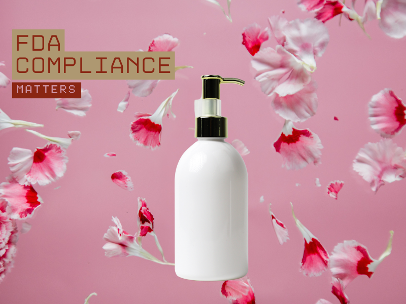 White haircare bottle on pink background with falling flowers, text reads 'FDA Compliance Matters'.