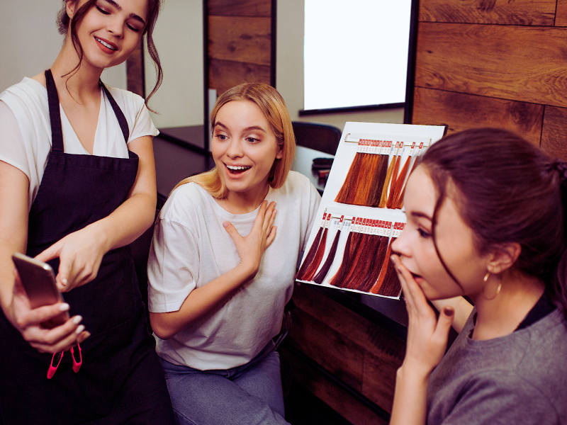 Happy ingredient-savvy clients review haircare menu, swatches and discuss salon product choices.