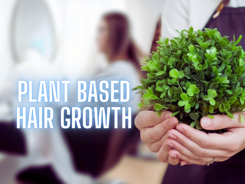 Close-up of a salon professional holding a vibrant green plant with the text 'Plant Based Hair Growth' in a salon setting.