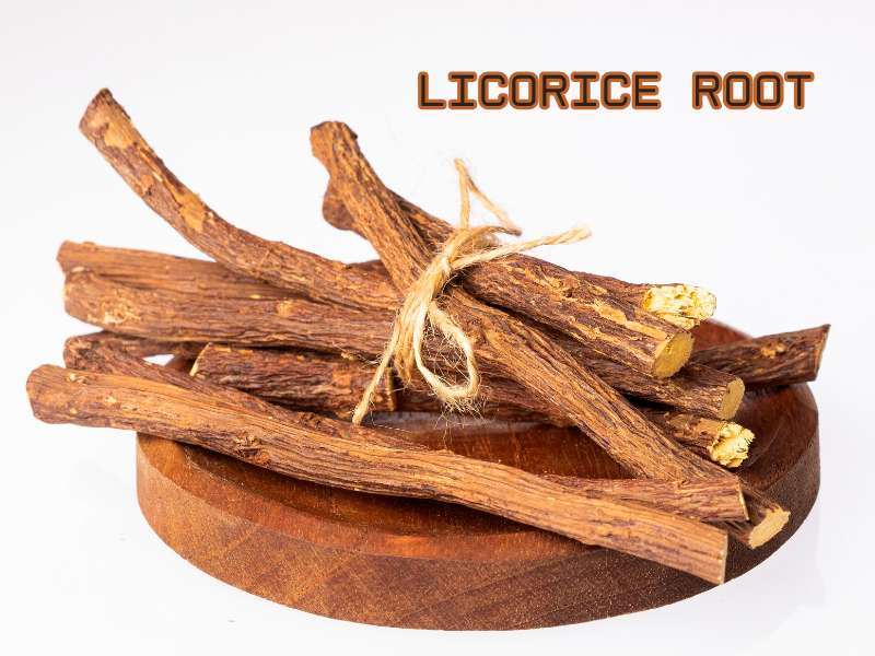 Dried licorice root bundle on a wooden plate, known for soothing scalp irritation and boosting healthy hair growth.